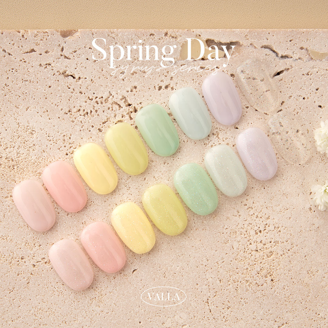 Pastel syrup series nail swatches laid on neutral textured surface.