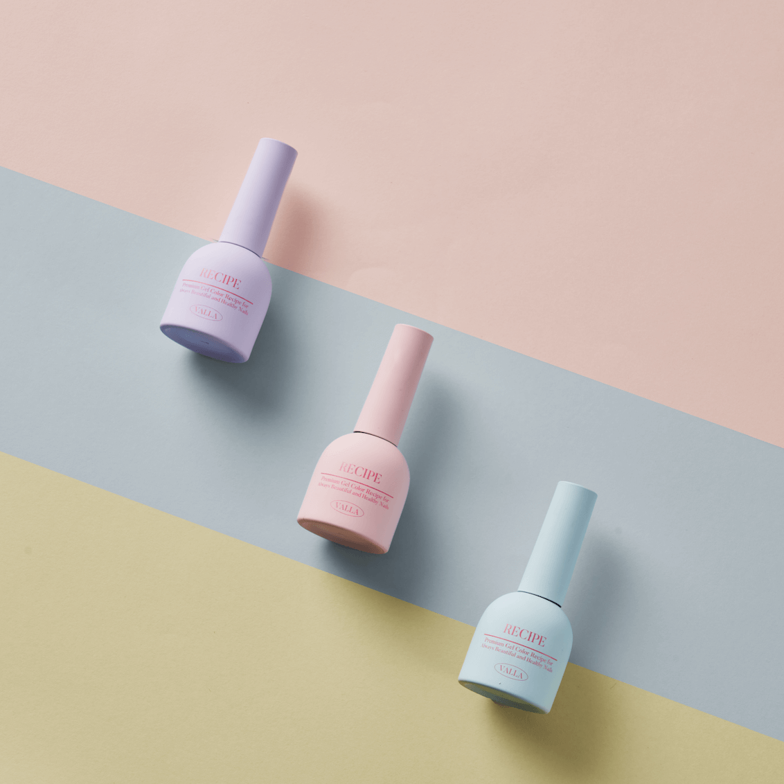 Valla Gel Cotton Pastel trio bottles styled with soft round props – modern and chic gel polish display