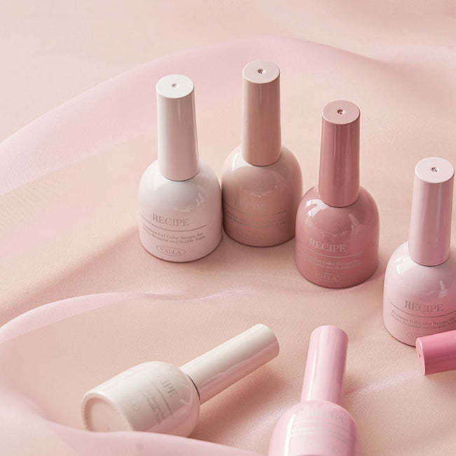 Dewy polish bottles photographed with fabric to enhance the fresh effect.