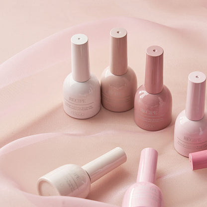 Dewy polish bottles photographed with fabric to enhance the fresh effect.