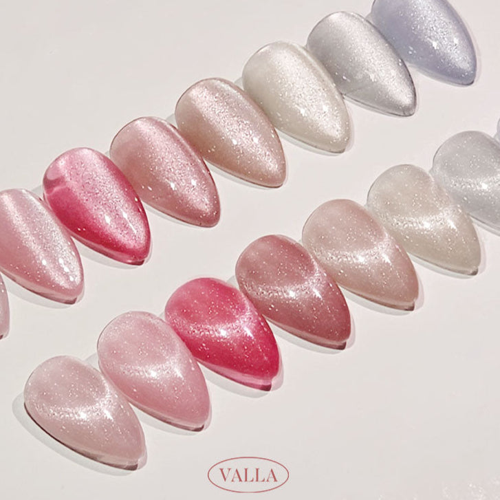 Transparent, glossy polish swatches in pink, beige, peach and lilac hues.