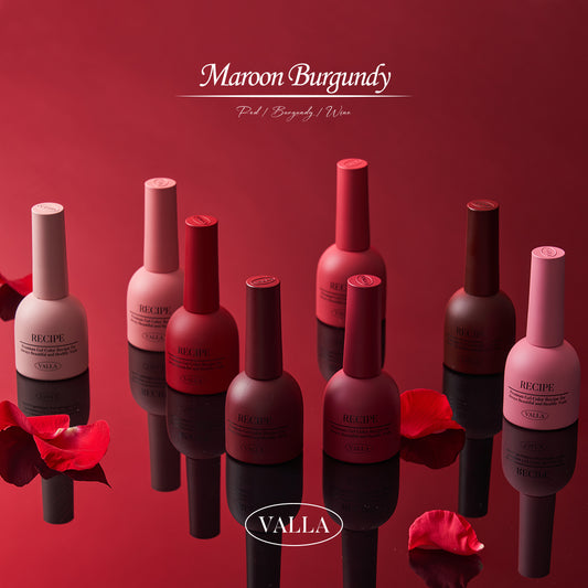 Deep red and burgundy gel polish bottles with rose petals from Valla's Maroon Burgundy Collection.