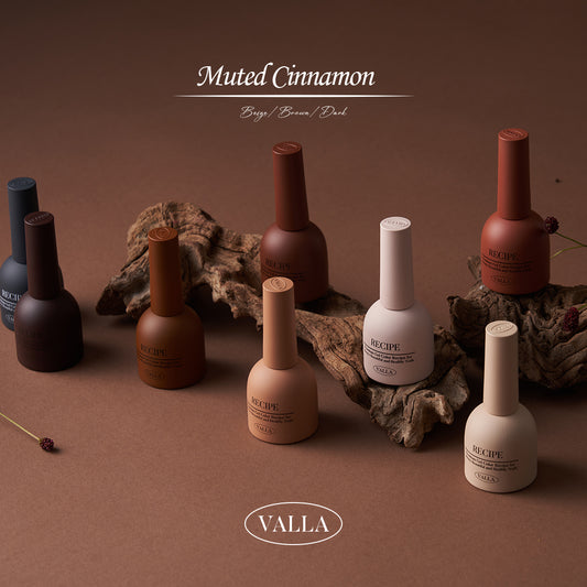 Earthy-toned gel polish bottles arranged on a painter’s palette with neutral shades.