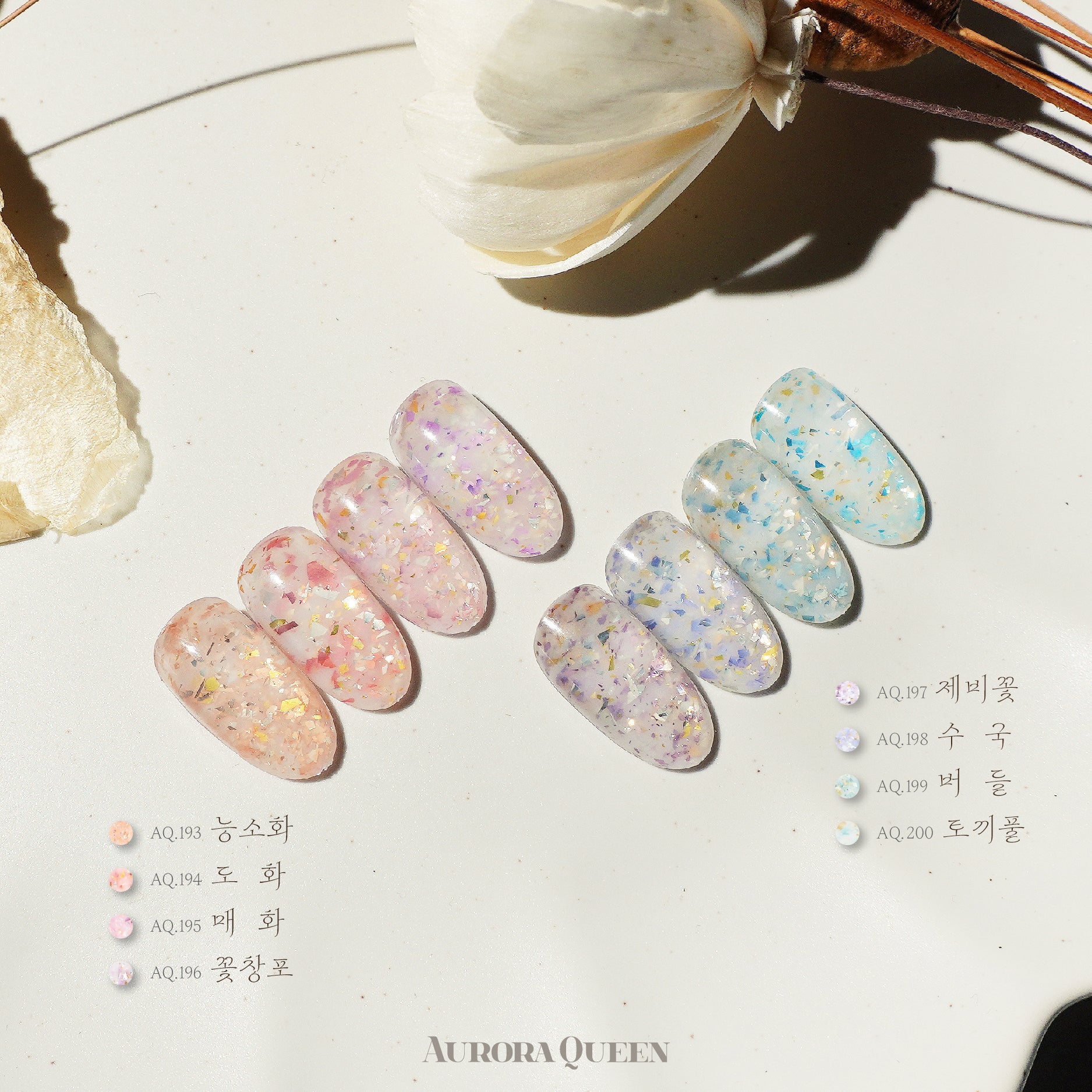 Flatlay showing pastel floral gel polishes in natural light