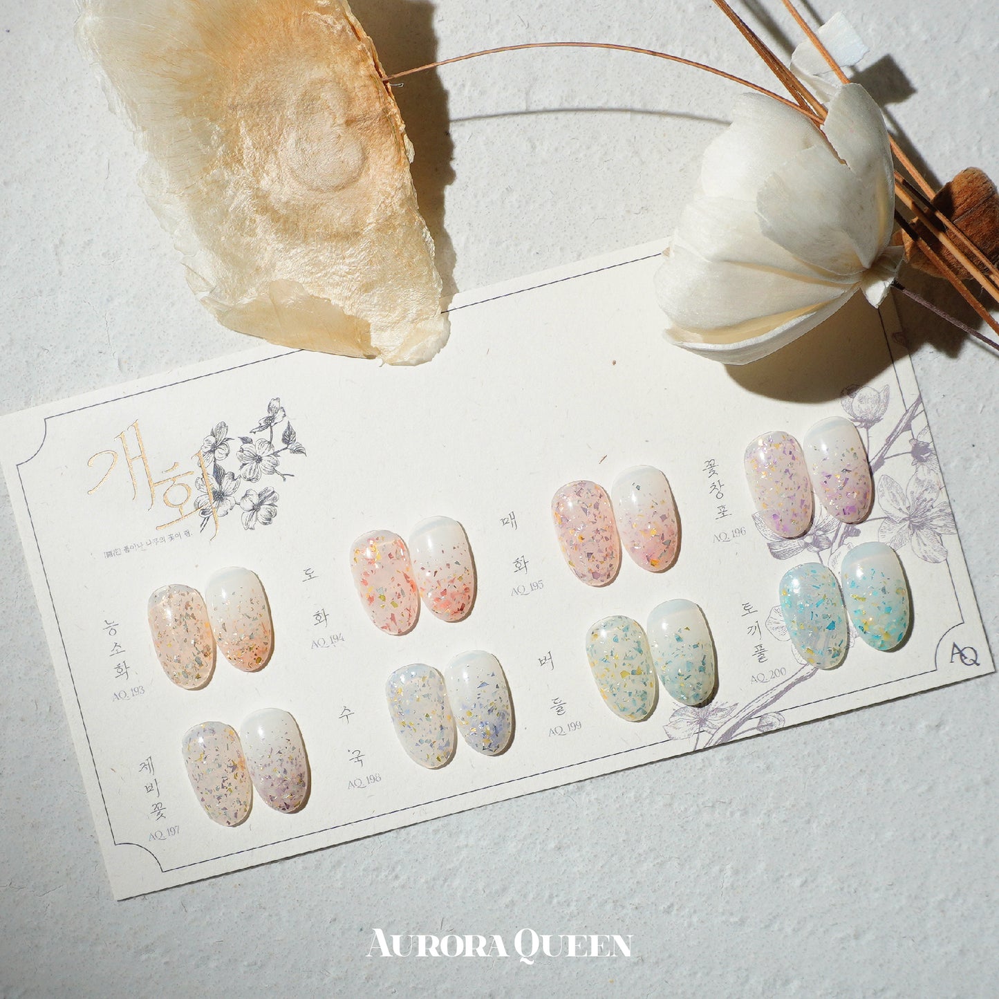 Flatlay showing pastel floral gel polishes in natural light