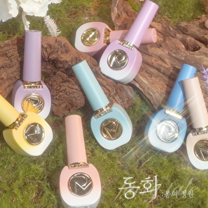 BY MUSE Fairy Tale pastel collection bottles styled in a whimsical garden-inspired flatlay