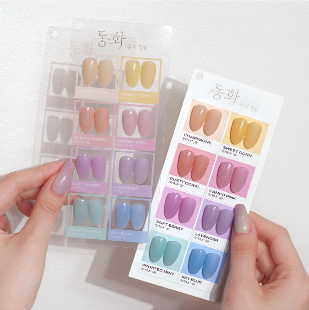 Model holding Fairy Tale collection swatch card with pastel shades by BY MUSE